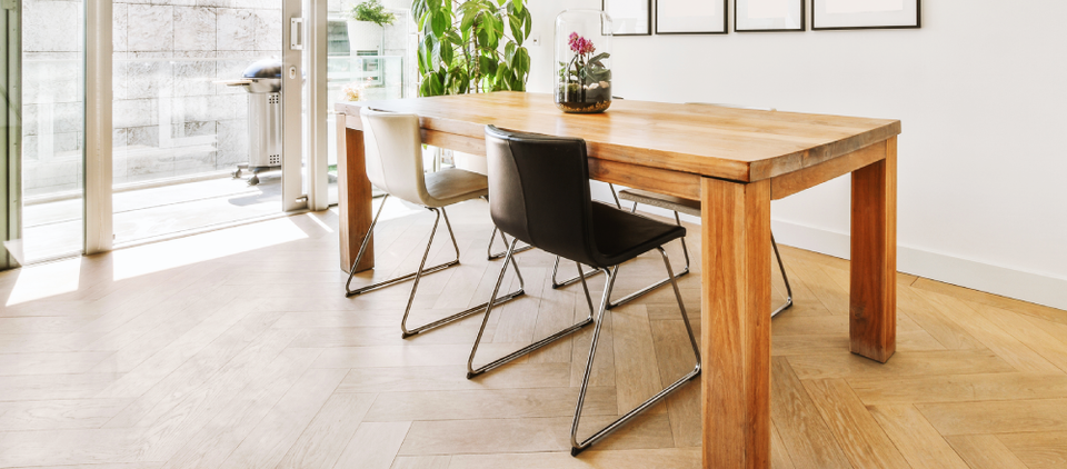 Modern dining room with light herringbone flooring. Modern dining room with light herringbone flooring.
