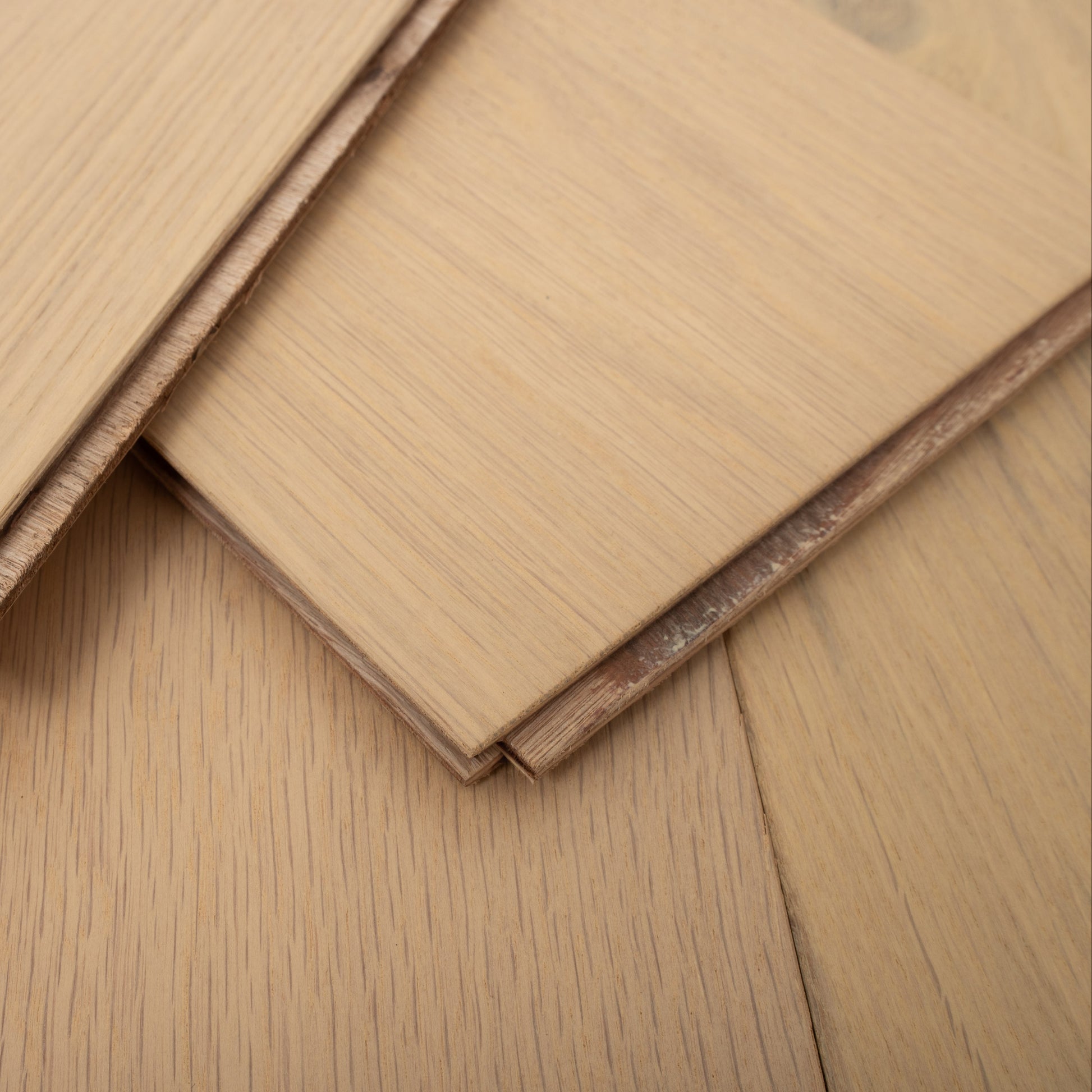 Close-up of wooden flooring panels on a wooden floor.