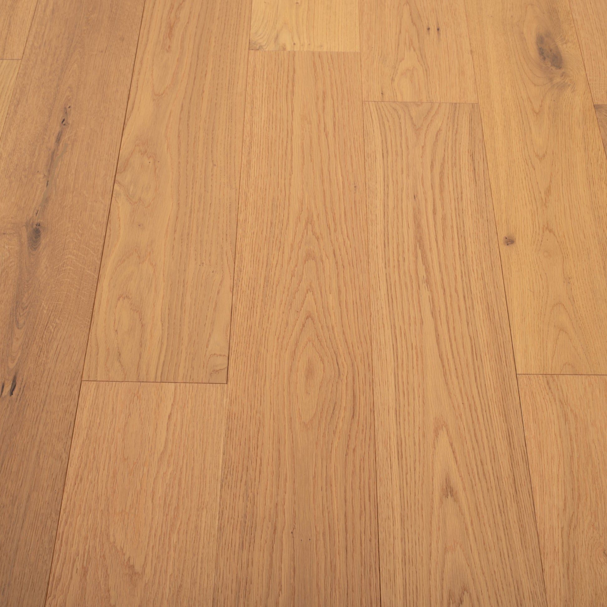 Close-up of a wooden floor with a warm brown color.