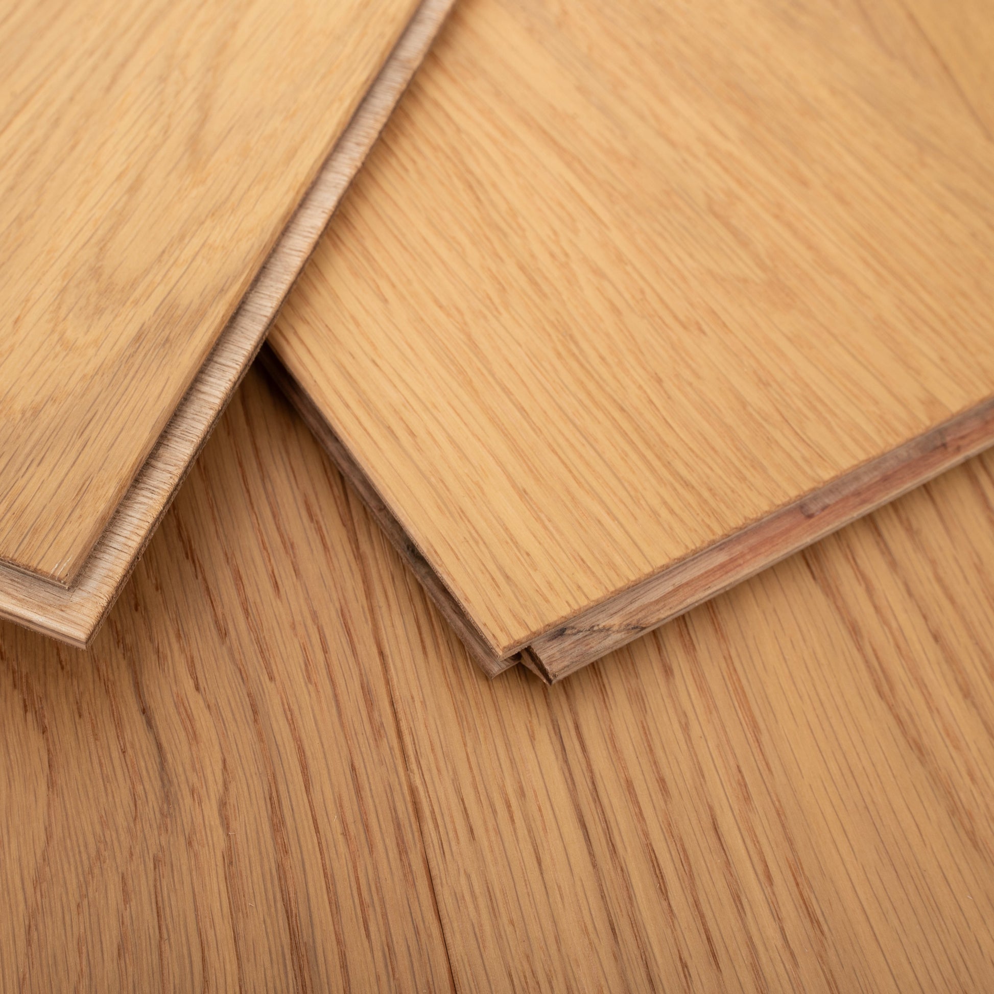 Close-up of wooden flooring panels with a focus on texture and grain.
