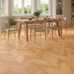 Dining room with wooden table and chairs on a parquet floor
