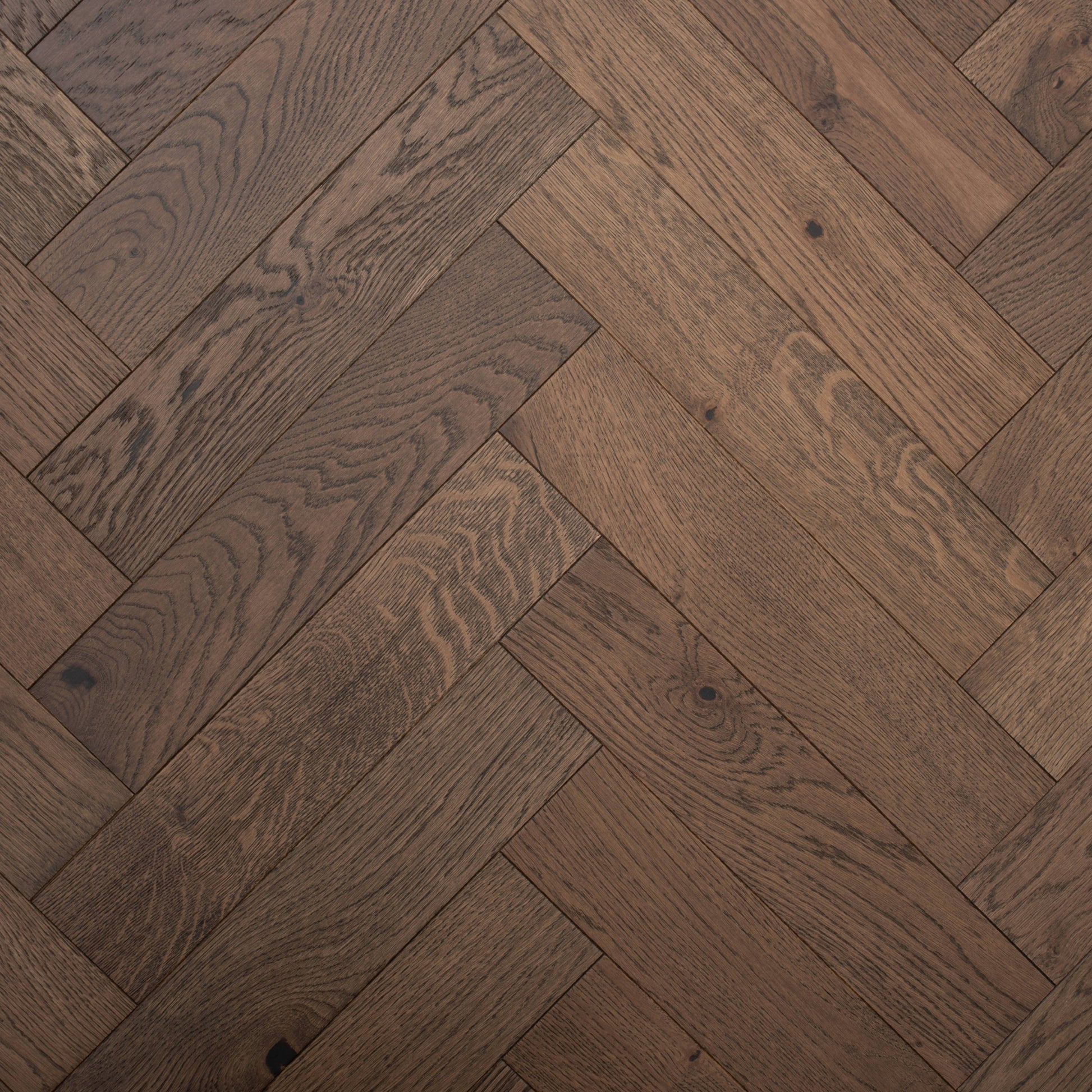Dark wooden floor with herringbone pattern